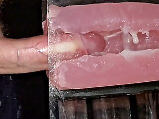 sex toy The guy fucks the masturbator hard and watches the sperm shoot inside big cock
